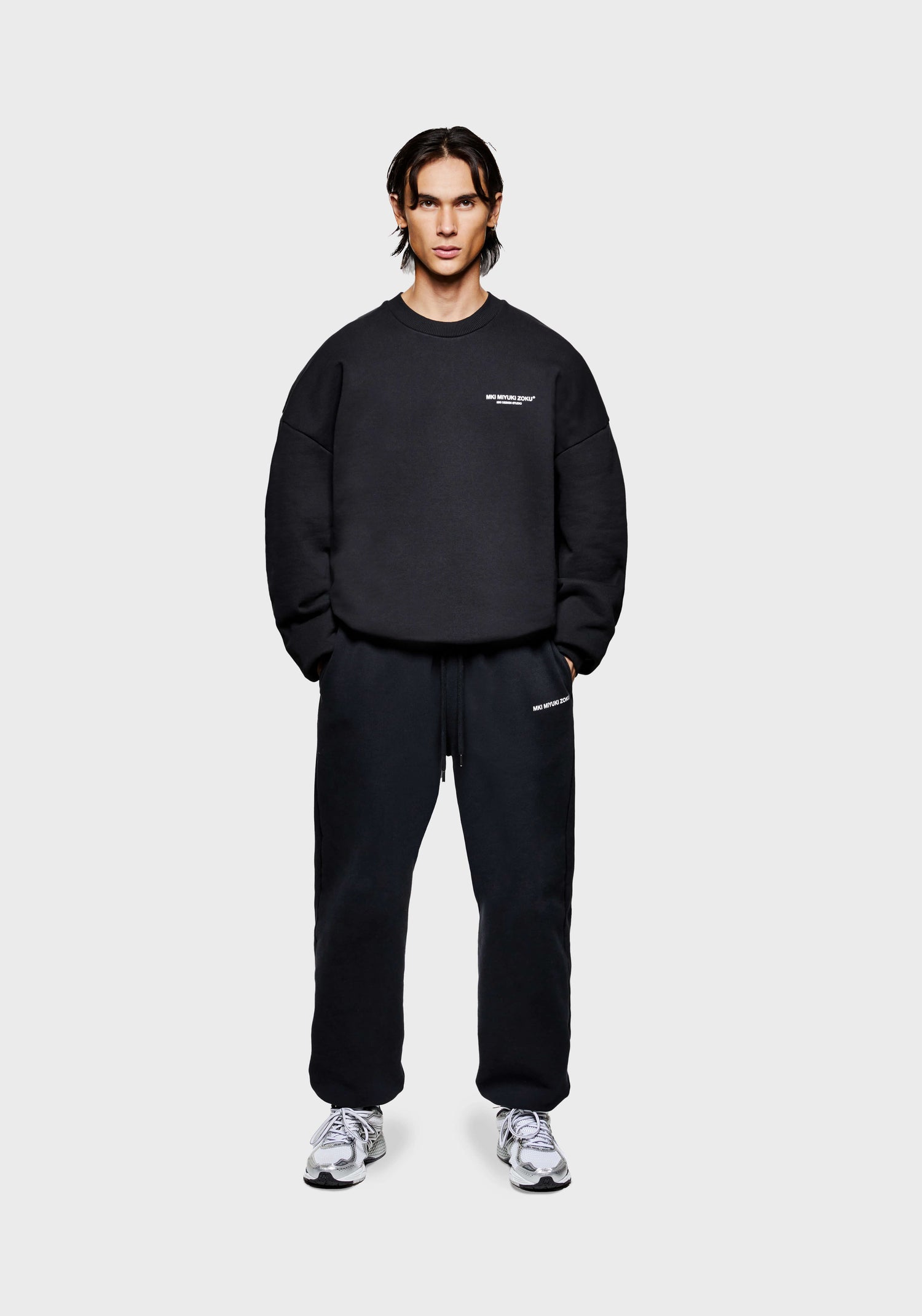 Full front view of the men's MKI Design Studio crew neck pull over sweatshirt in a black colour in a boxy fit