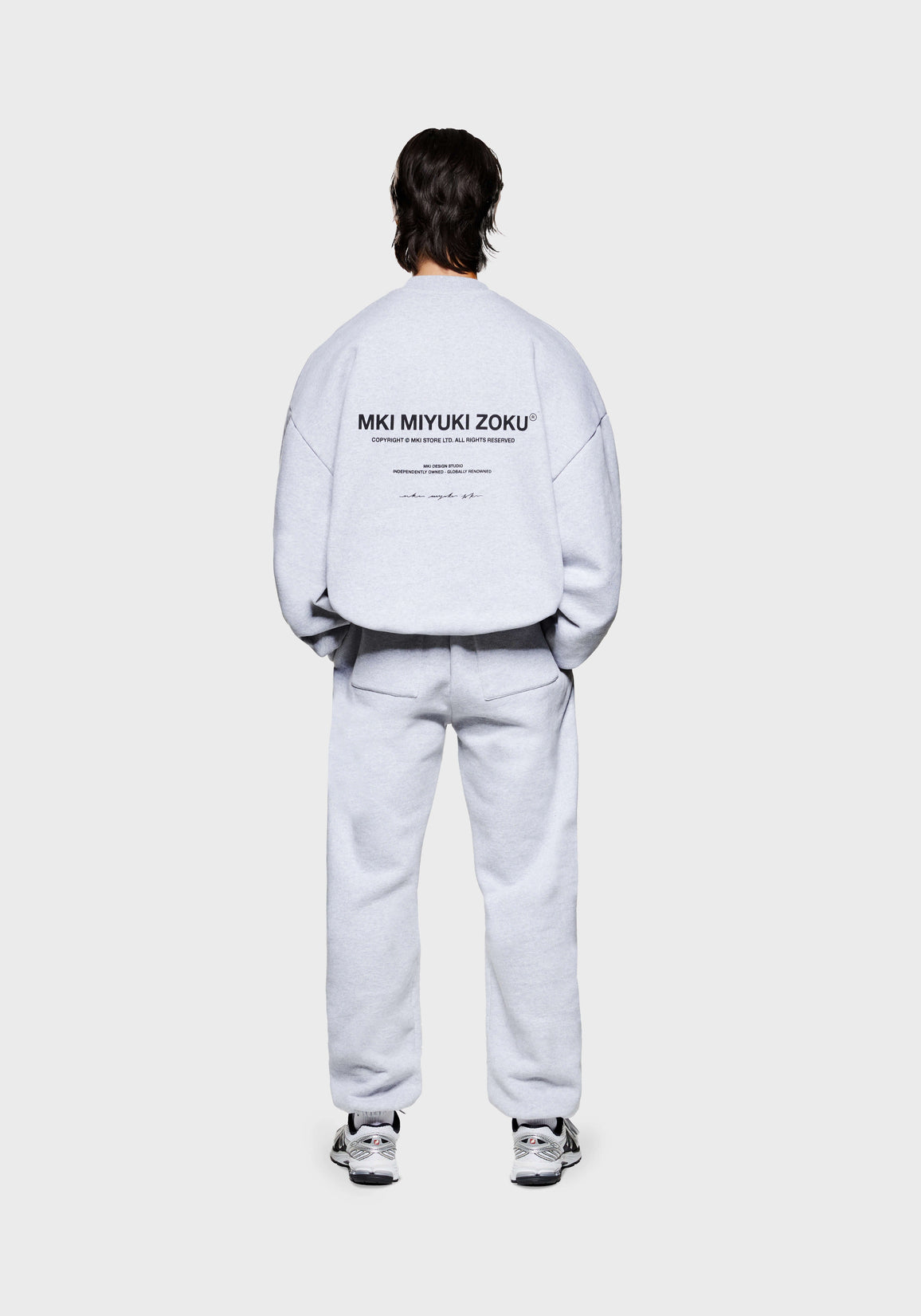 Full back view of the MKI MIYUKI ZOKU Design Studio Crewneck in Grey, in an oversized box fit