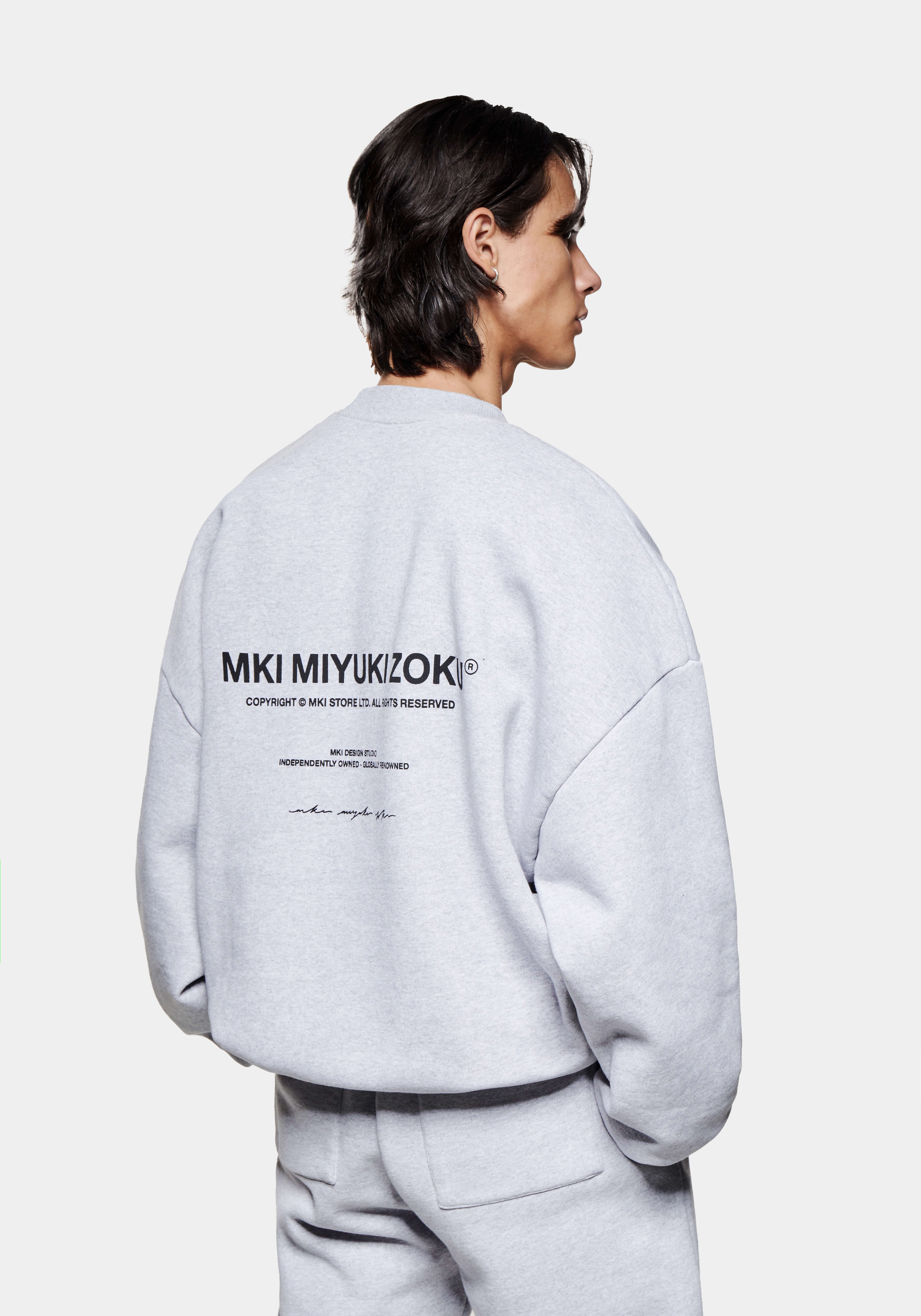 Back side view of the Design Studio Crewneck in Grey