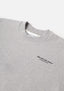 Flat close-up of the contrast Design Studio branding on the chest of the Design Studio Crewneck in Grey