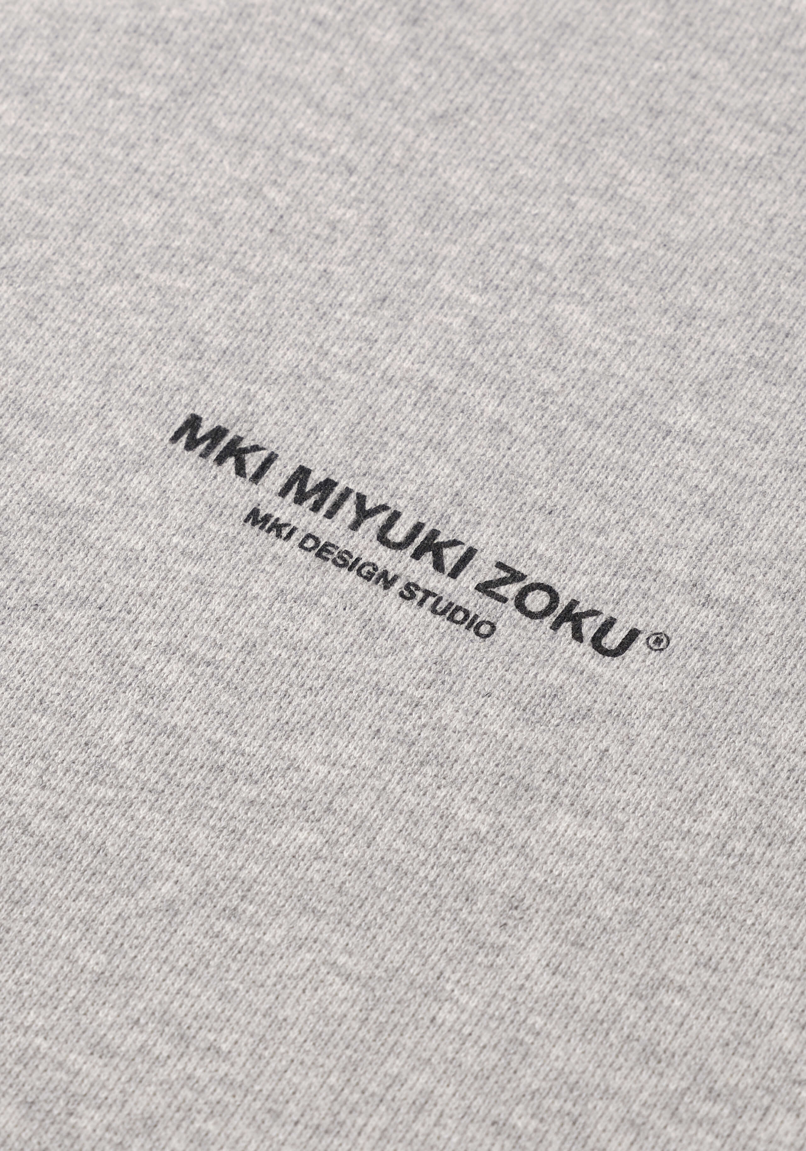 Flat close-up of the black graphic print on the Design Studio Crewneck in Grey
