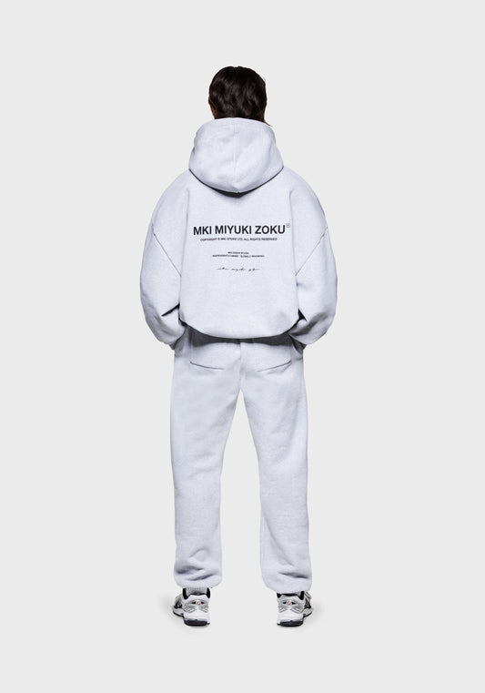 Rear view of the MKI 500gsm boxy fit heavyweight Design Studio hoodie for men in a grey colourway