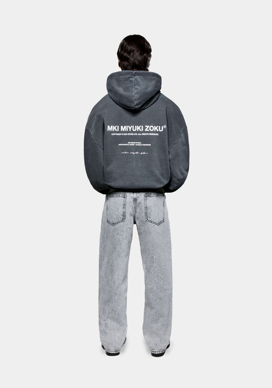 Rear view of the MKI 500gsm boxy fit heavyweight Design Studio hoodie for men in a washed black colourway