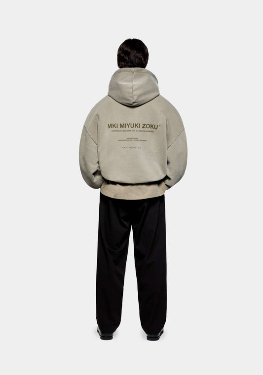Rear view of the MKI 500gsm boxy fit heavyweight Design Studio hoodie for men in a washed olive colourway