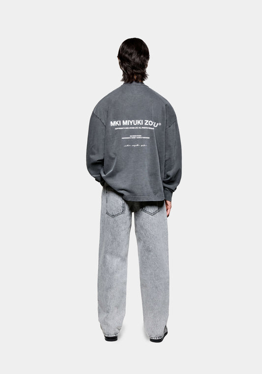 Full back view of the MKI Design Studio long sleeve oversized t-shirt in a pigment black colour in a boxy fit