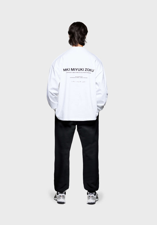 Full back view of the MKI Design Studio long sleeve oversized t-shirt in a white colourway in a boxy fit