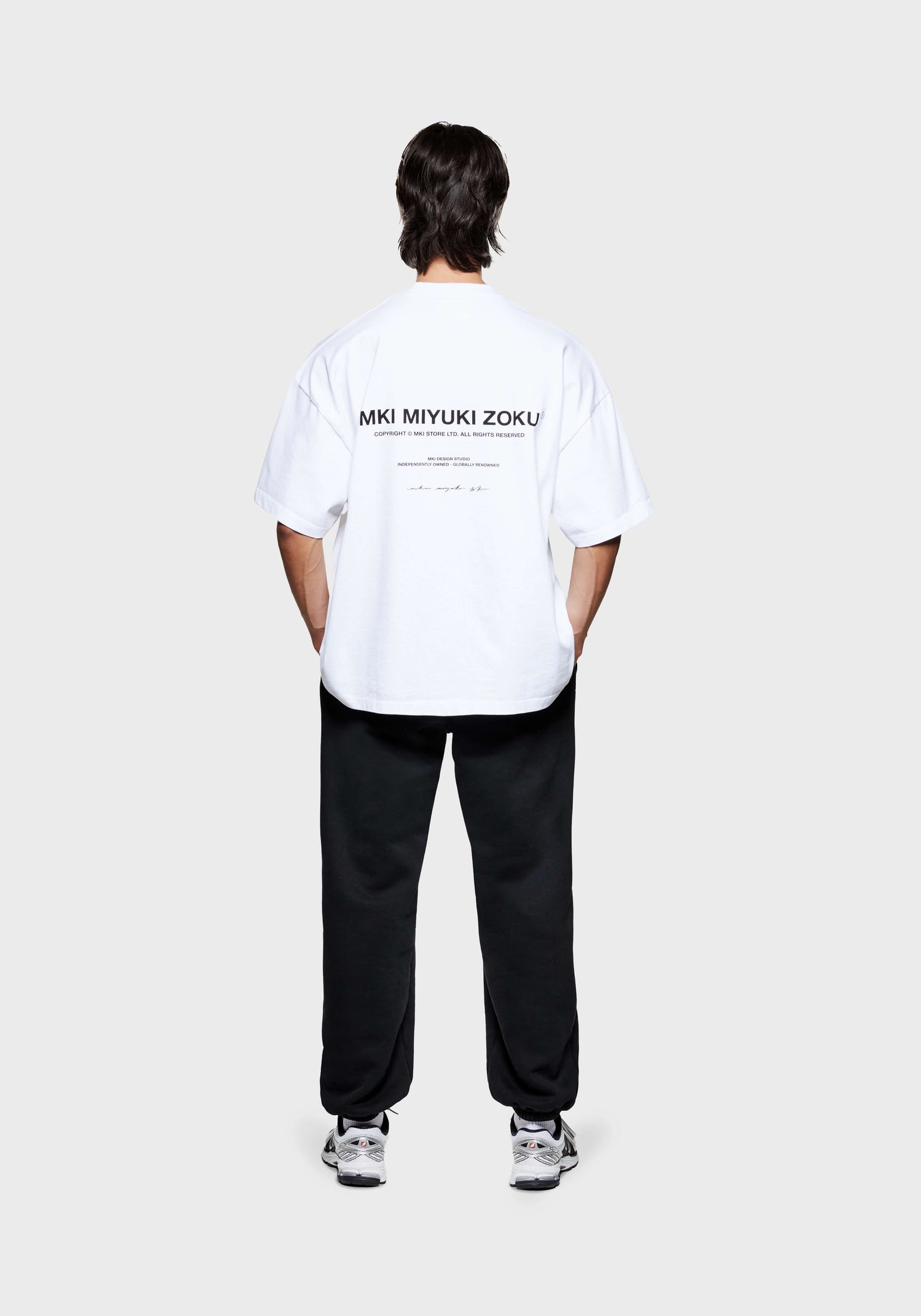 MKI Men's designer T-Shirt in White with black Design Studio graphics printed at the back