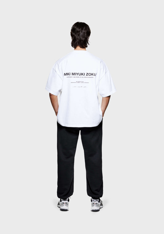 MKI Men's designer T-Shirt in White with black Design Studio graphics printed at the back
