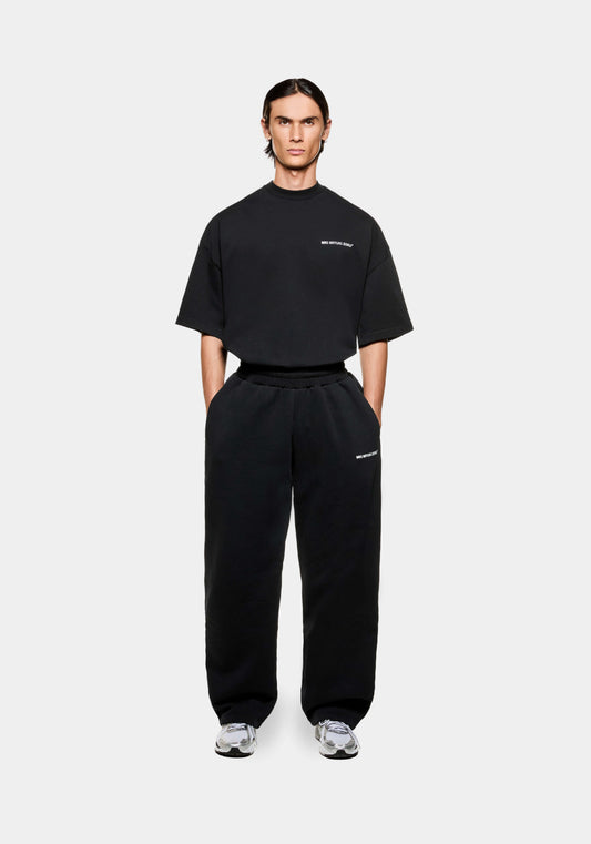 Front view of the MKI men's open hem Wide Leg joggers in black cotton jersey with minimal logo branding