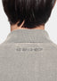 Close-up of the tonal MKI MIYUKI ZOKU logo embroidered at the back neck