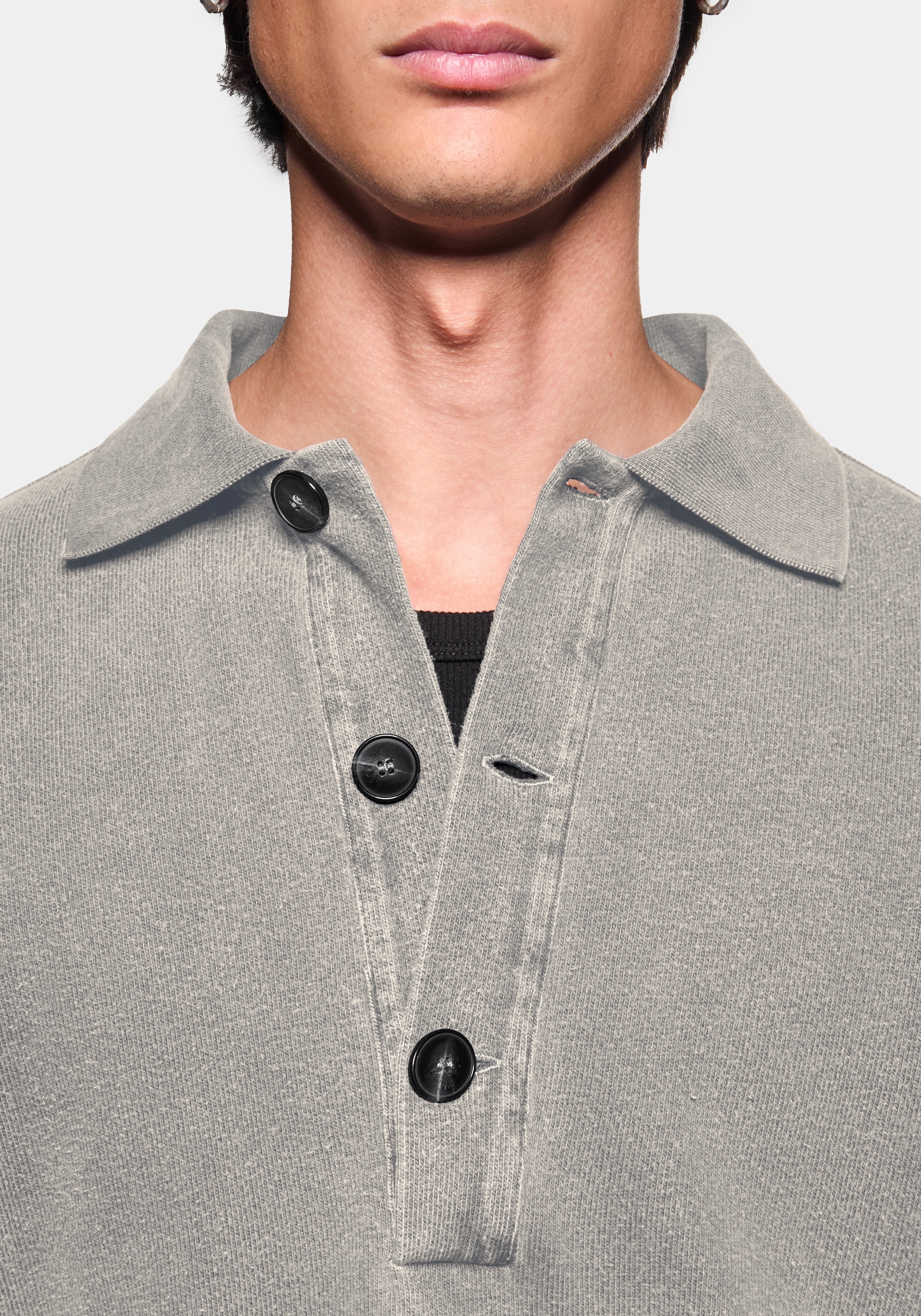 Close-up of the ribbed rugby collar and three button placket