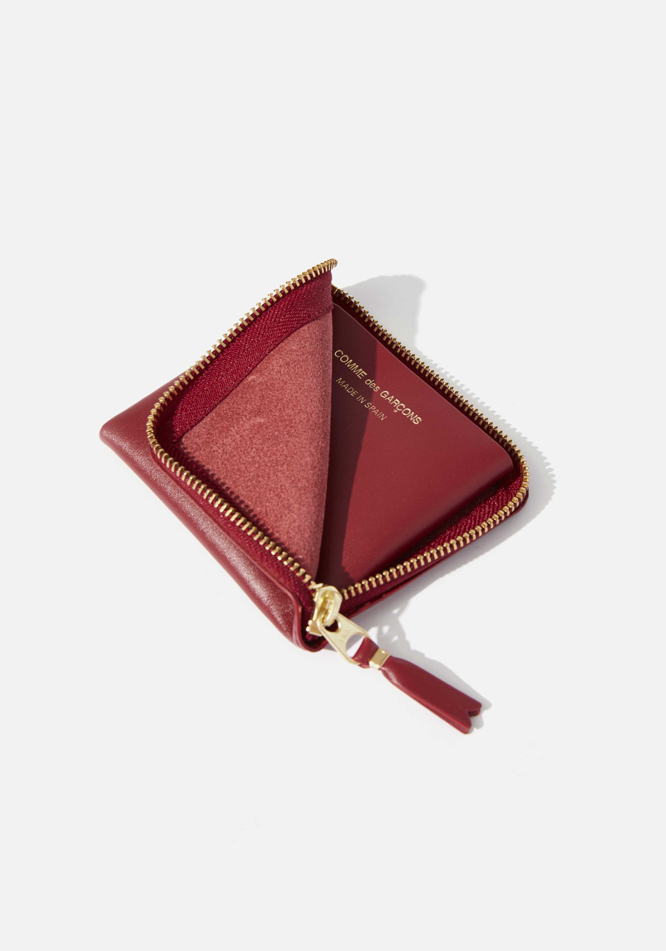COMME DES GARCONS HALF ZIP WALLET